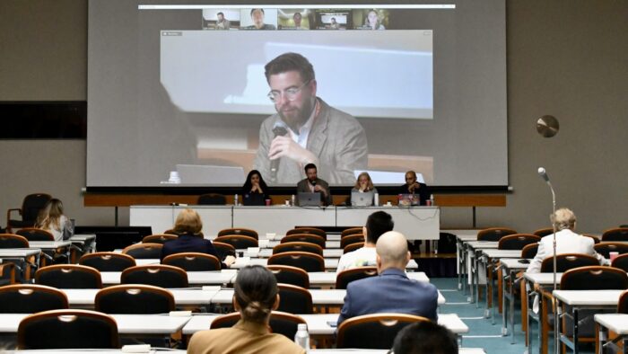 Florian Ostmann talking at a conference